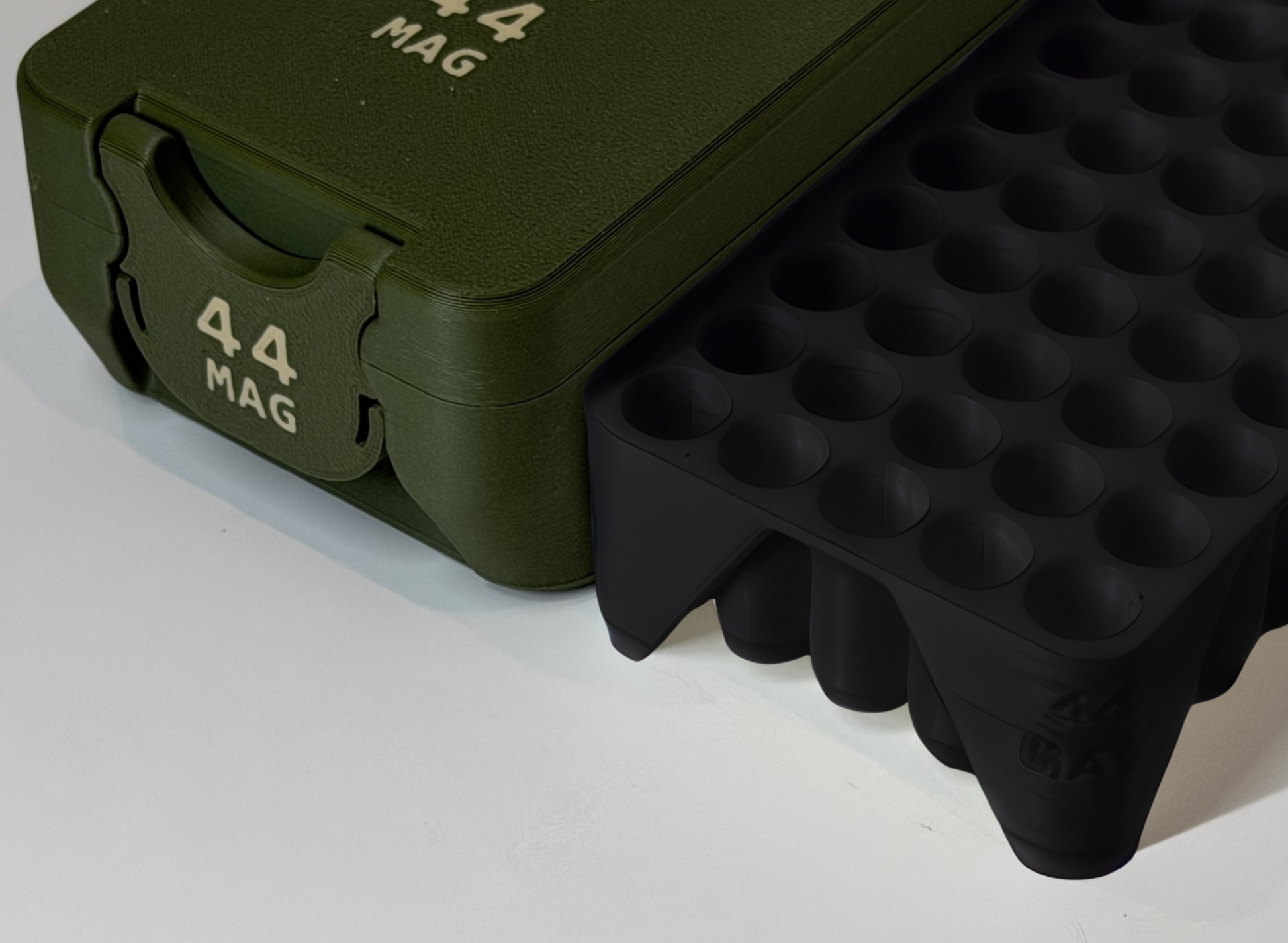 Green and black tactical Ammo Box with '44 MAG' with lable